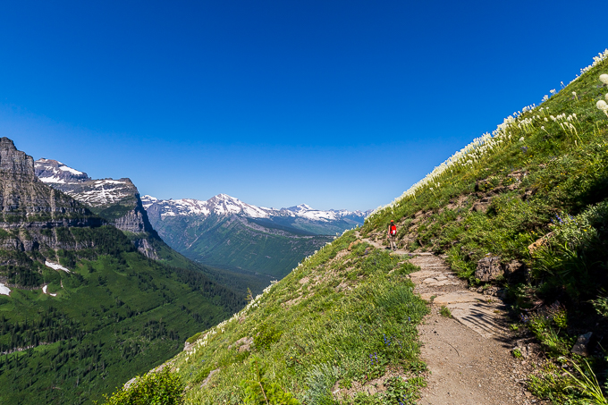 Bicycle ride Going to the Sun Road - Logan Pass - cyclist on road near Saint Mary Lake