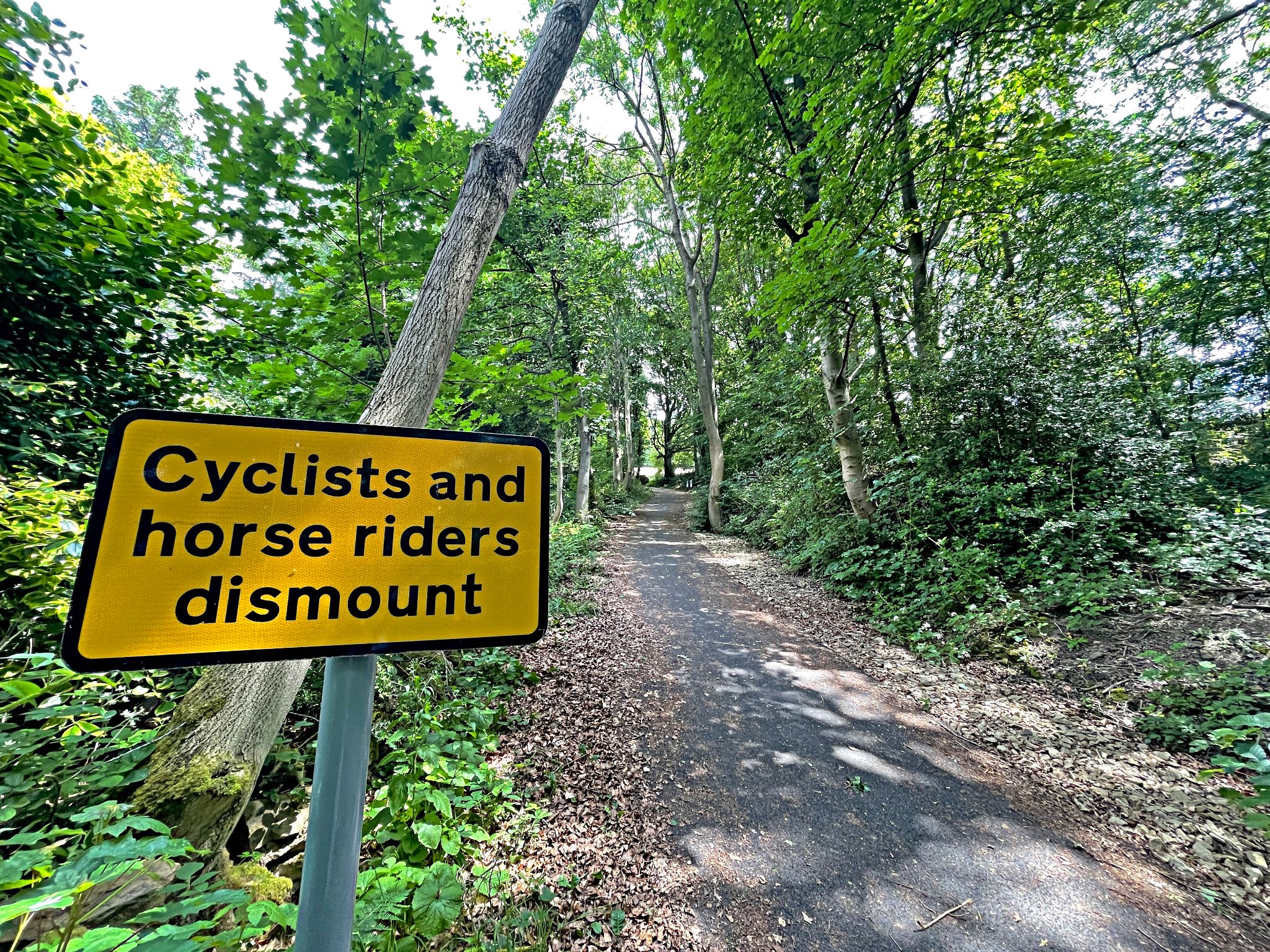 Cycling Bamford Clough street sign reads "Cyclists and Horse Riders Dismount"