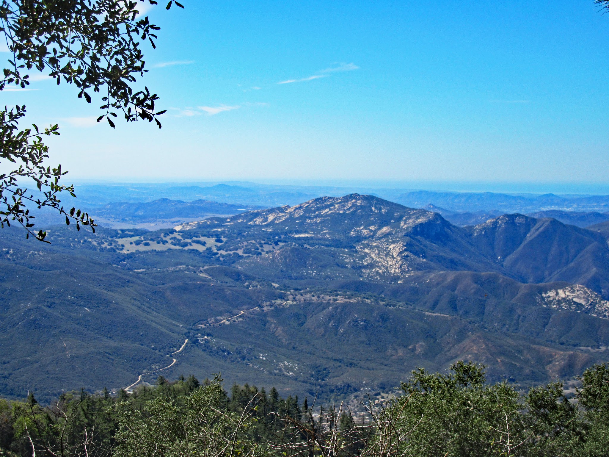 Cycling up East Grade Road - views of distant mountains
