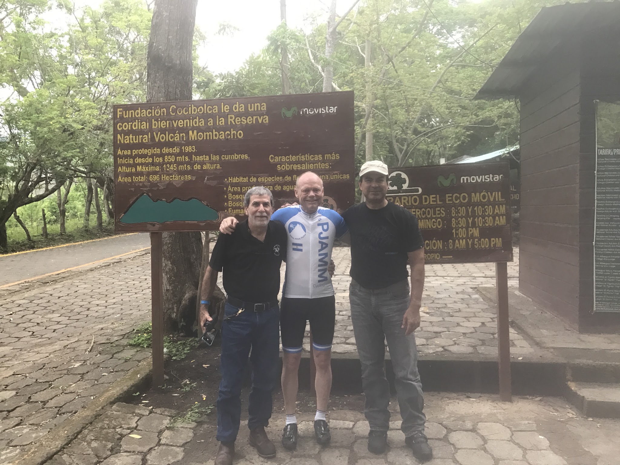 Mombacho Volcano - the director of the preserve Biking up Mombacho Volcano - with the director of the preserve at bus stop, park sign