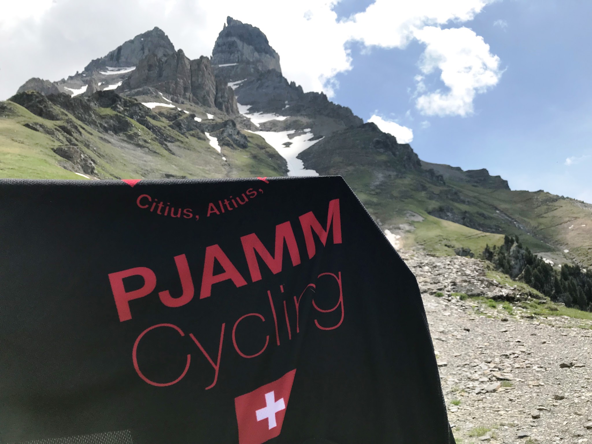 Climbing Rionda with bicycle - PJAMM jersey with La Cime de l'Est in background