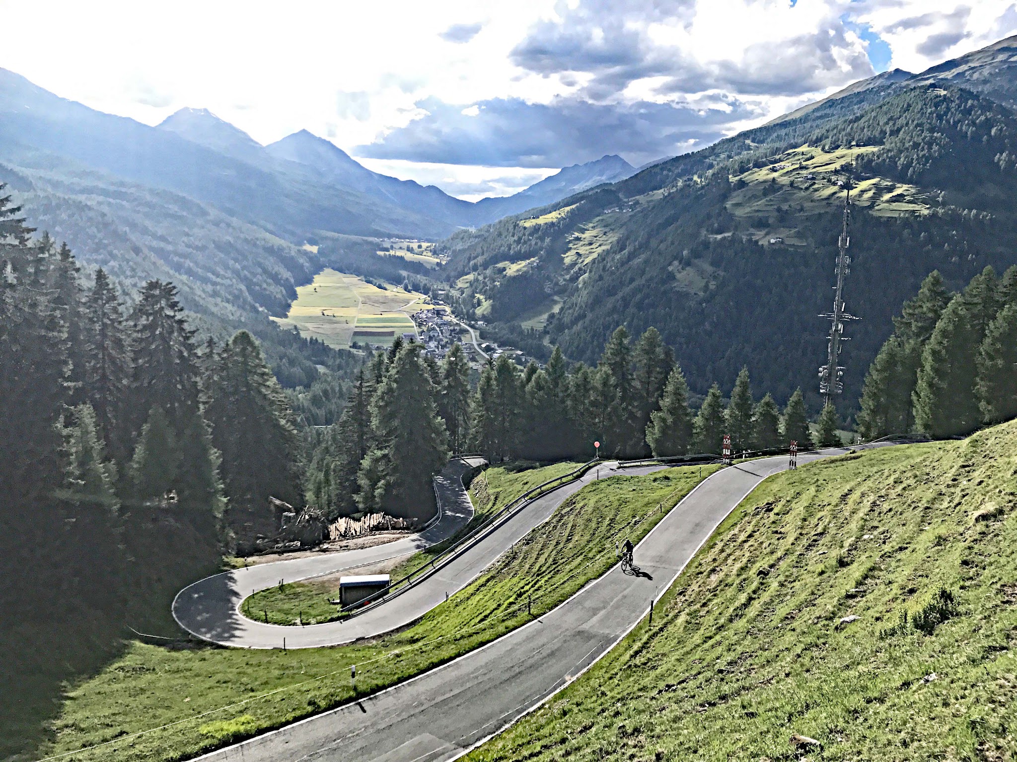 Bike climb of Umbrail Pass - hairpins and cyclist
