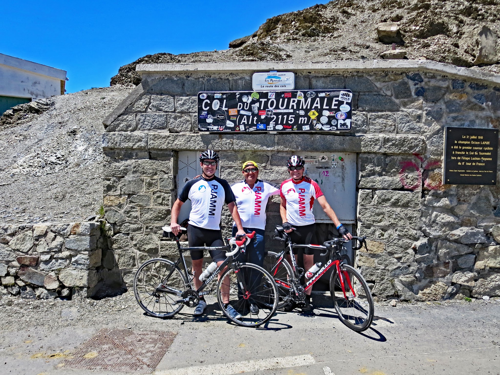 Col du Tourmalet cycling trip summer 2013 - cyclists at col with col sign and Le Geant