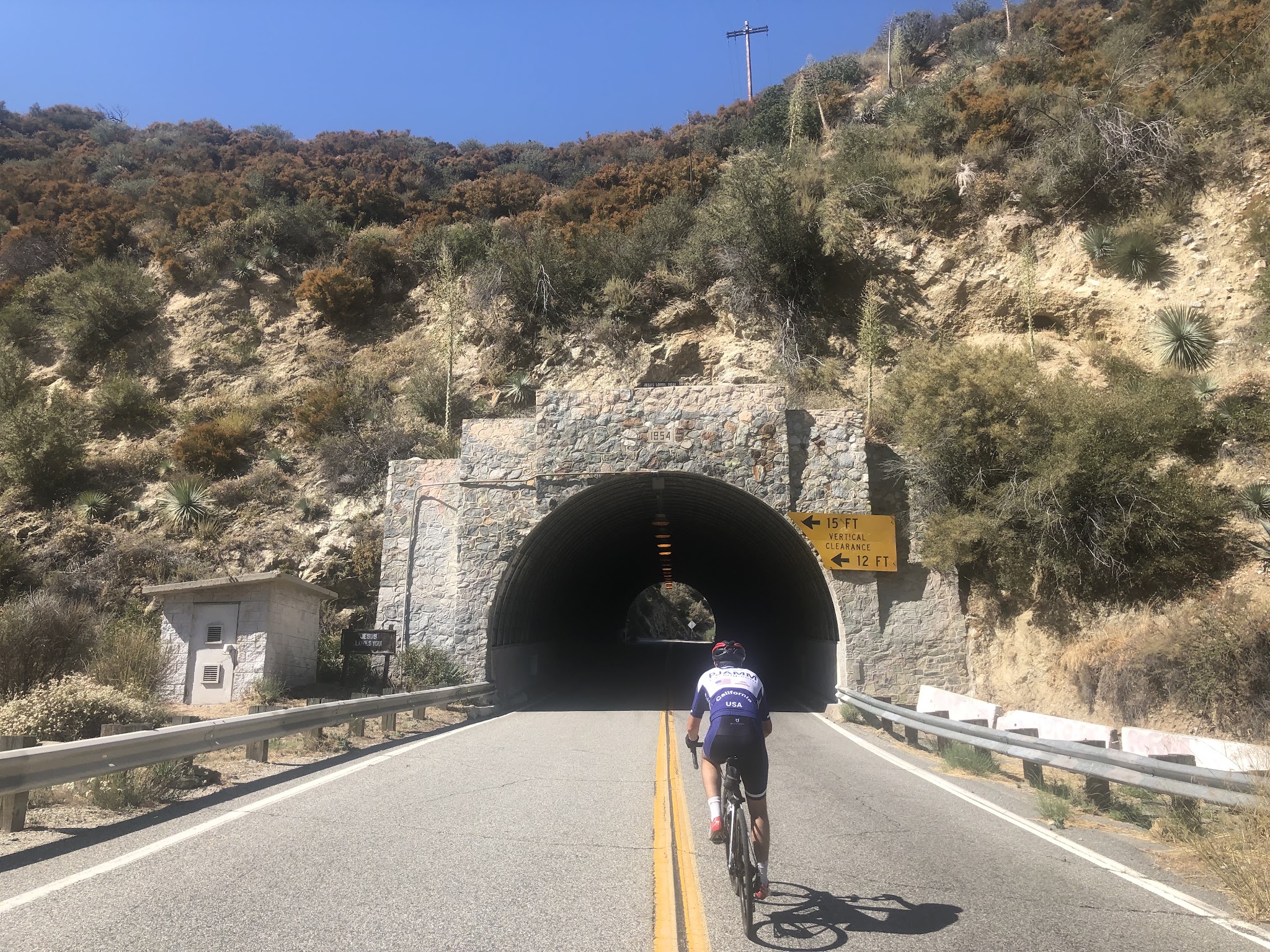Bicyclist on bike entering tunnel on Mt Baldy