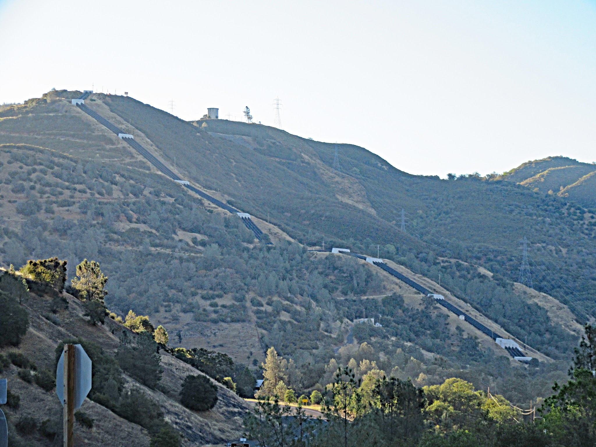Bike climb of Old Priest Grade - water pipes on steep hillside