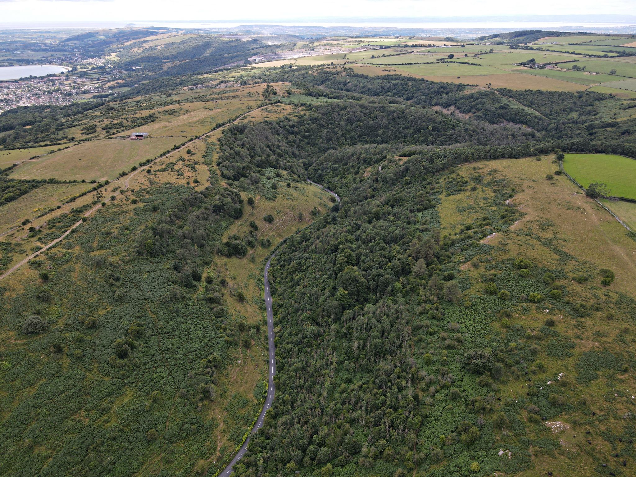 aerial drone view shows the roadway back up from the gorge to town of Cheddar