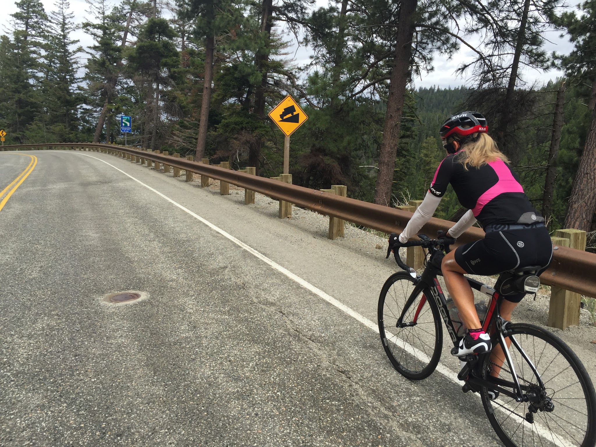 Bike climb - Washington Top Bike Climbs - Mission Ridge - cyclists riding past steep grade road sign