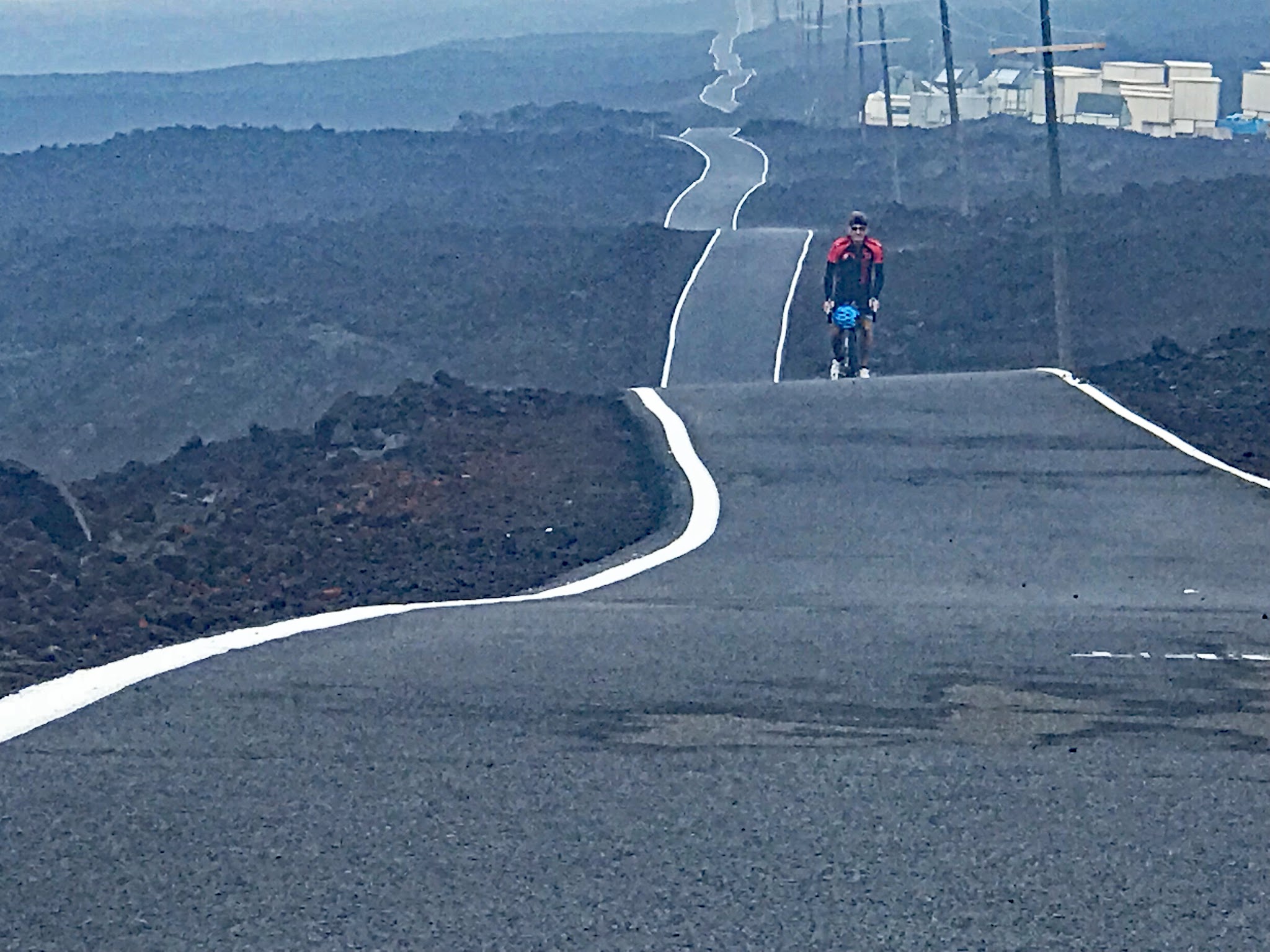 Bicycling longest road in the world - Mauna Loa Volcano - undulating roadway