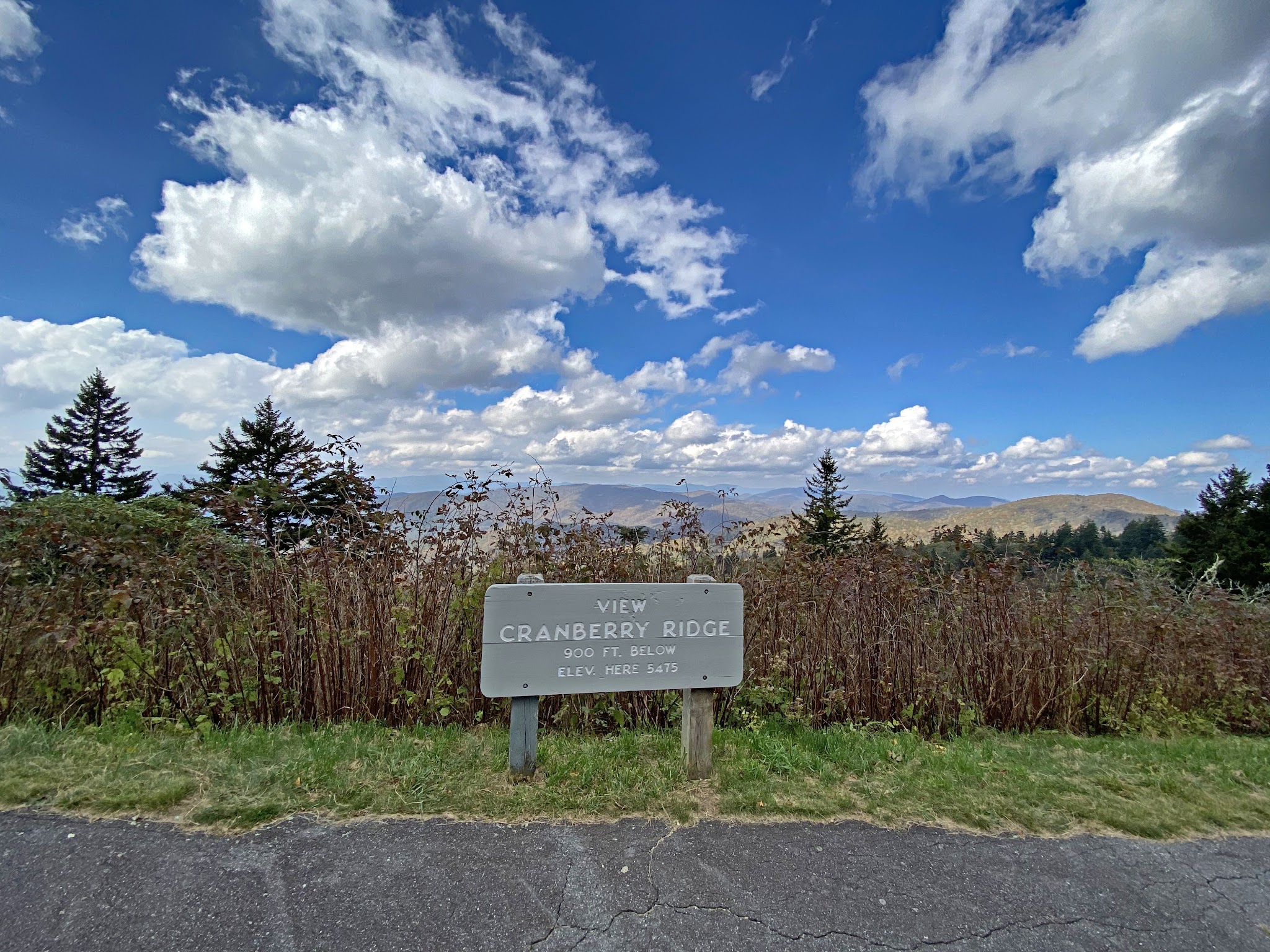 Cycling Waterrock Knob from Highway 19, North Carolina - trail sign for Cranberry Ridge overlook, Blue Ridge Parkway, blue sky, forestation