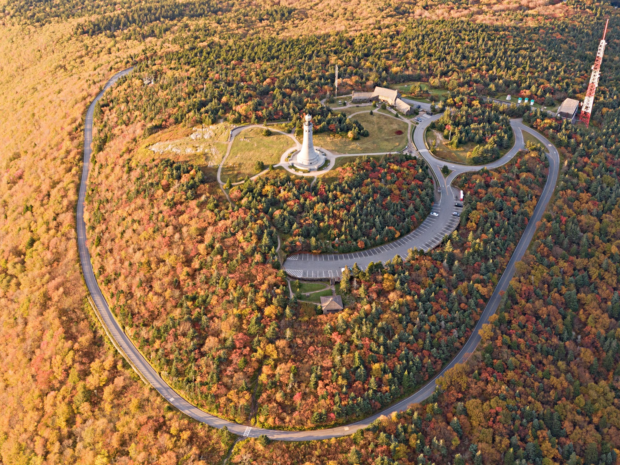 Cycling Mt. Greylock, Massachusetts  - aerial drone view of Veterans Memorial Tower, fall foliage