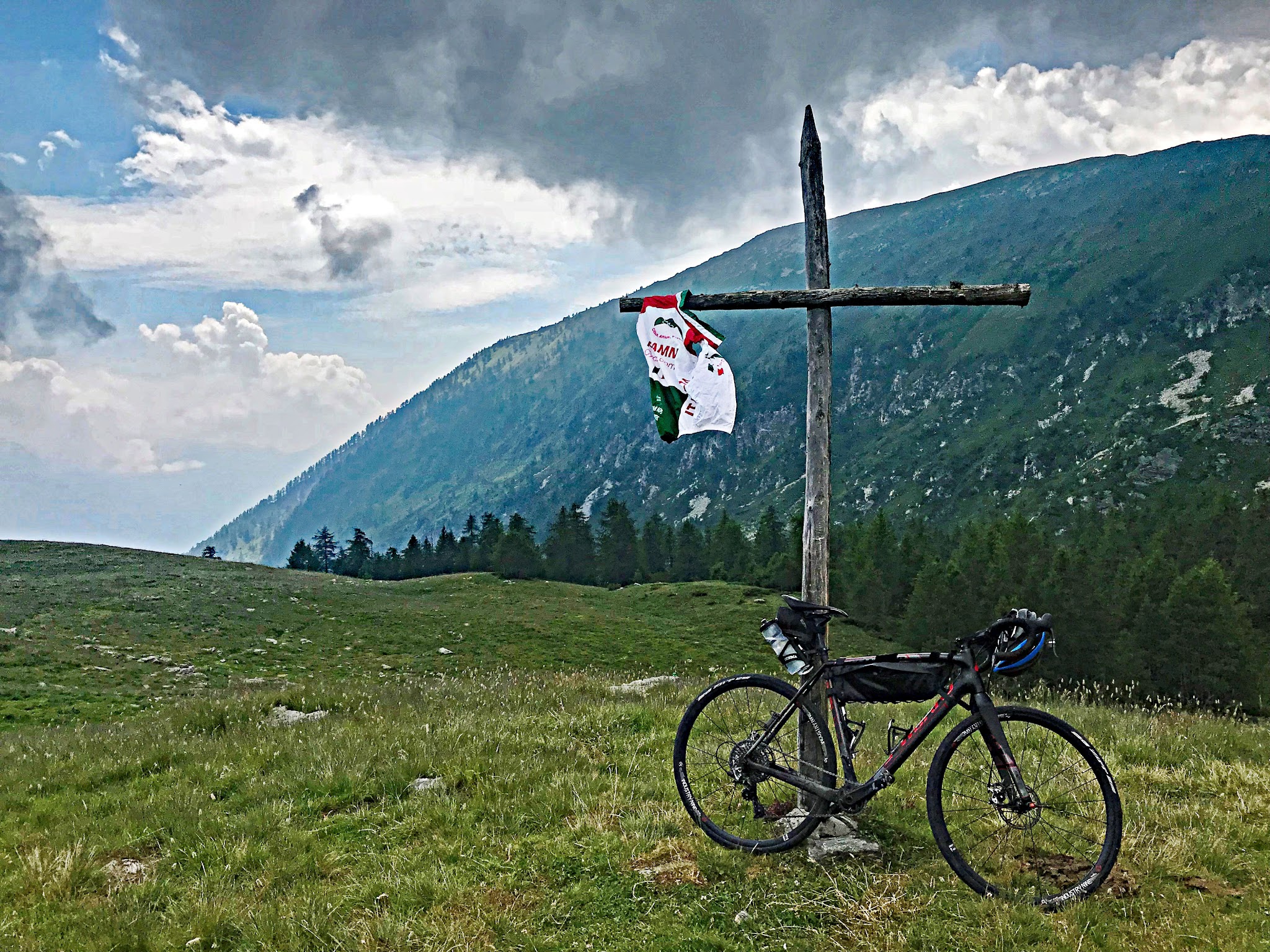 Alpe Fuori Bike Climb - Village below Lago d' Andromia Bike climb Alpe Fuori - cross with cycling vest on it and bike