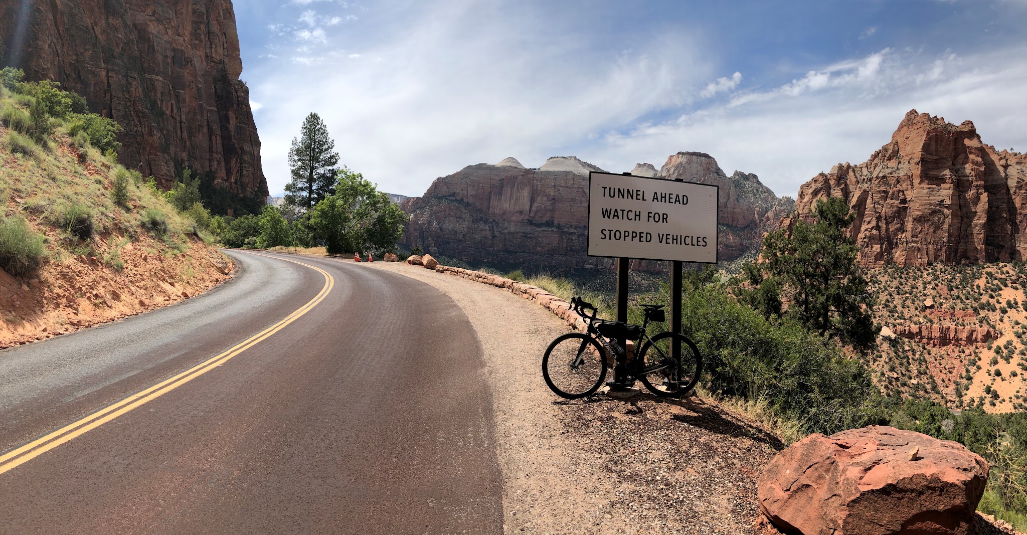 Hwy 9 to Zion Tunnel Cycling Hwy 9 to Zion Tunnel - bike leaning against tunnel sign on road with rock formations