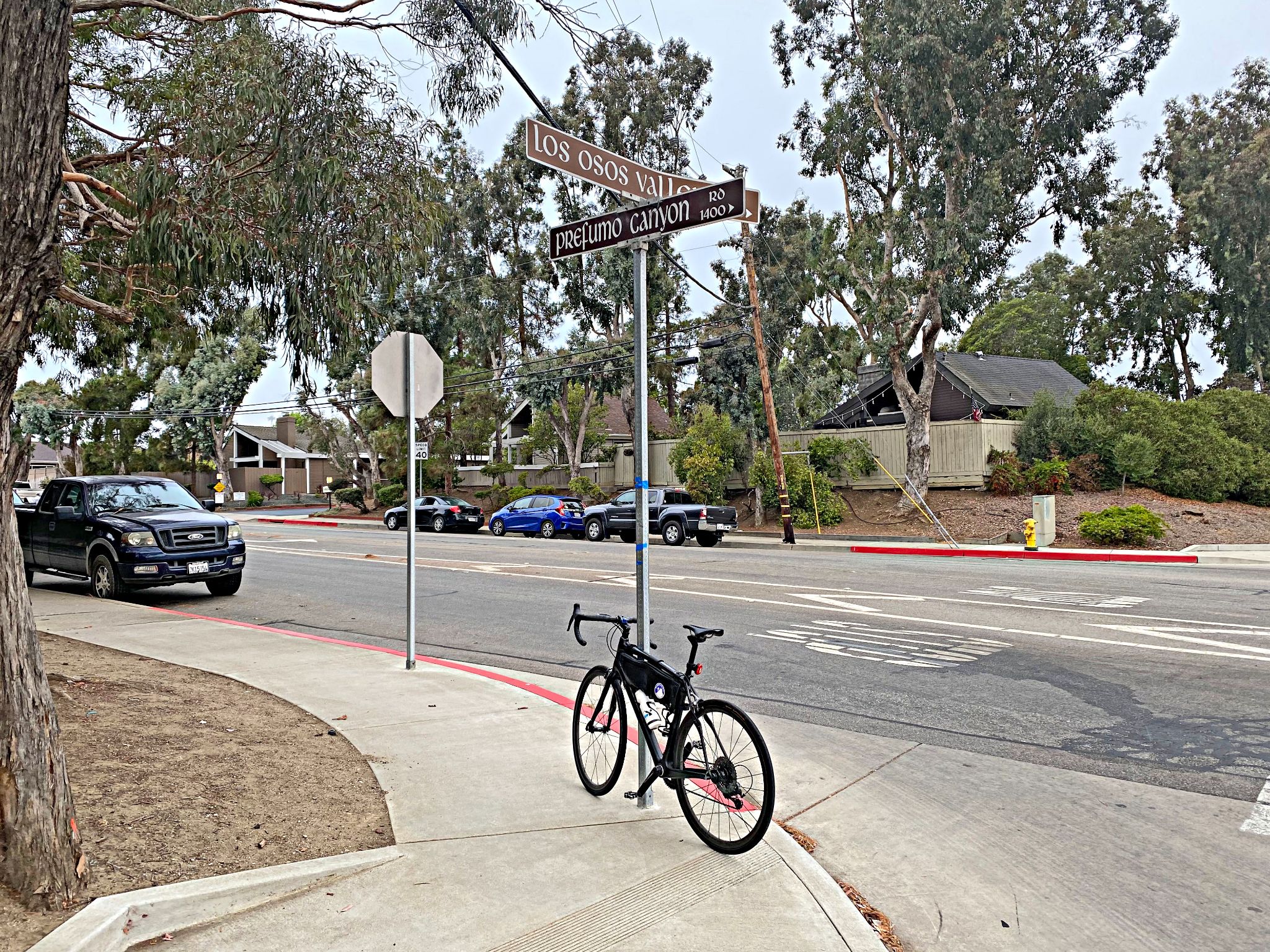 bike parked at street sign at intersection of Los Osos Valley Road and Prefumo Canyon Road