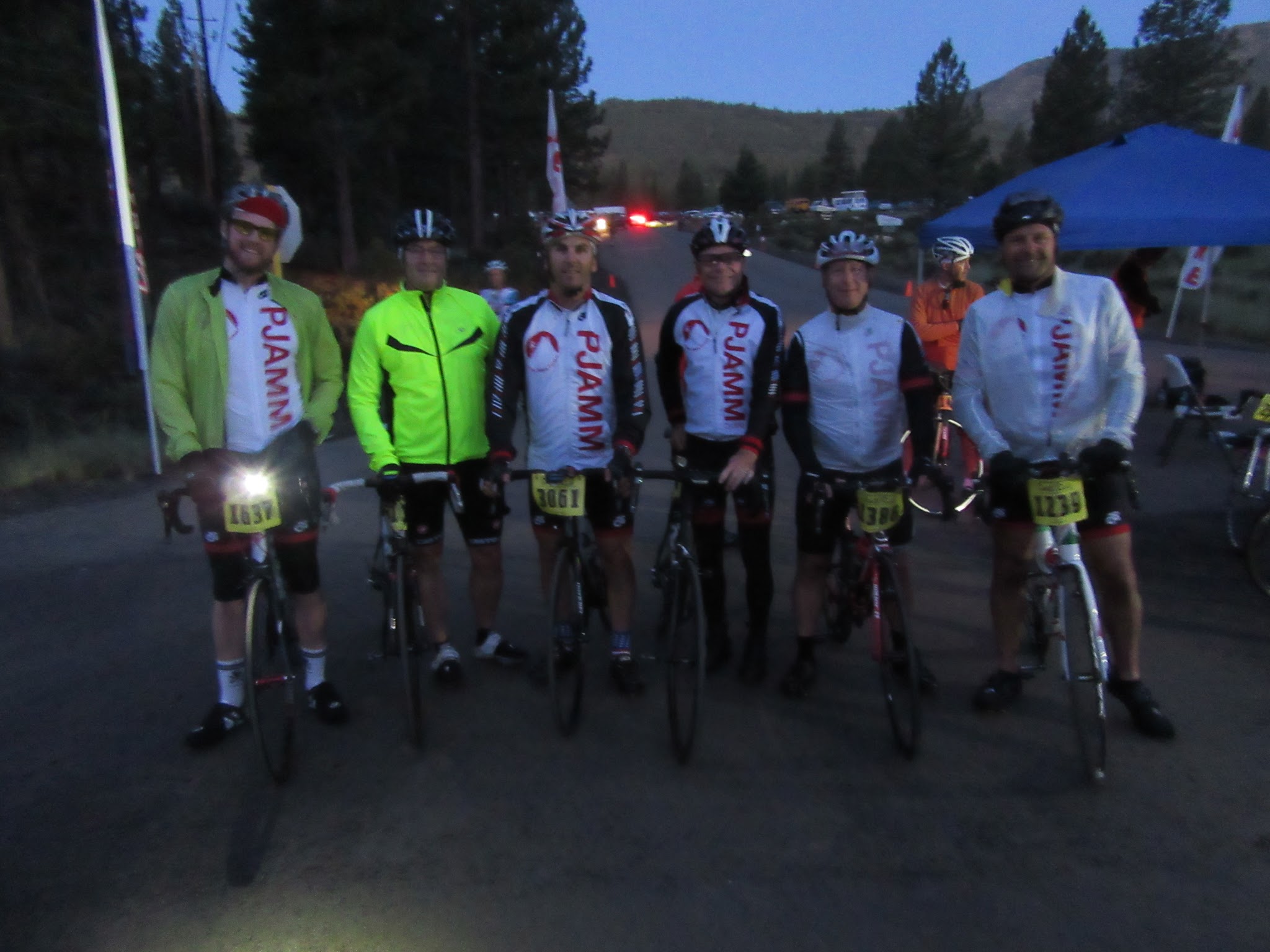 Death Ride PJAMM Cyclists stand with their bikes before sunrise, at start of Death Ride