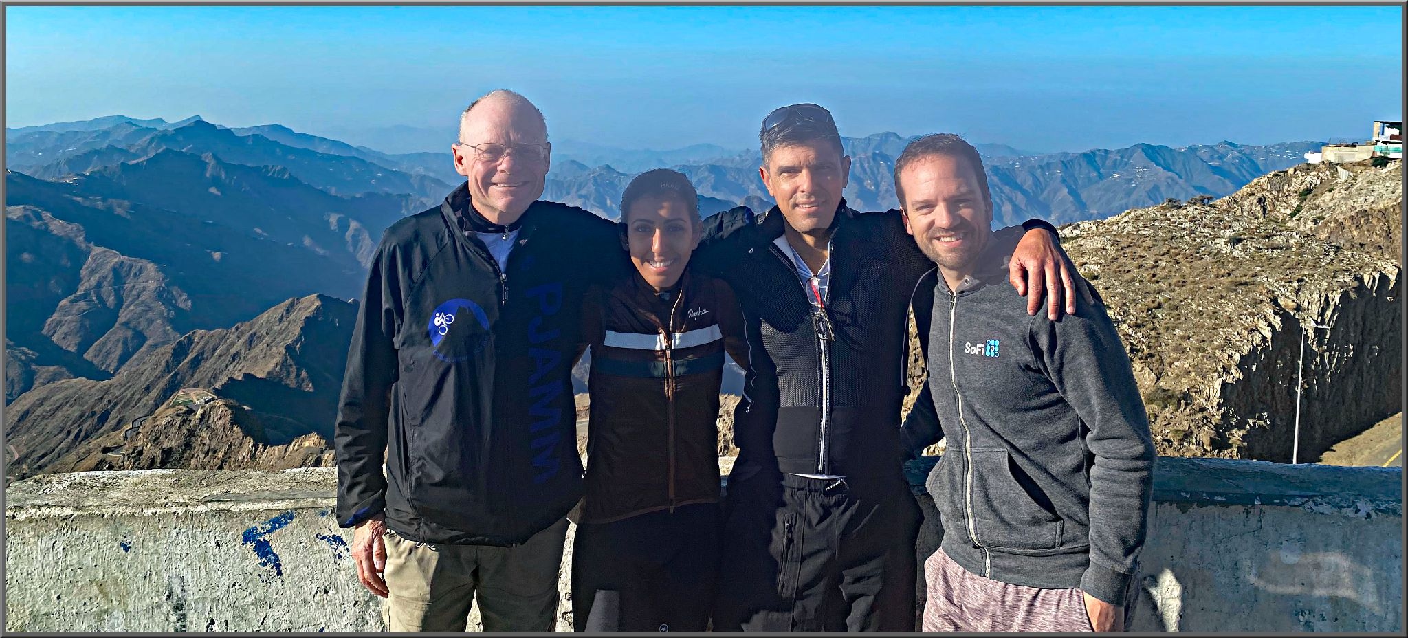 Cycling Mount Souda, Saudi Arabia - John stands with Ahlam Zaid, Christiaan Beyers, and Steven Olyer on top of Mt. Souda