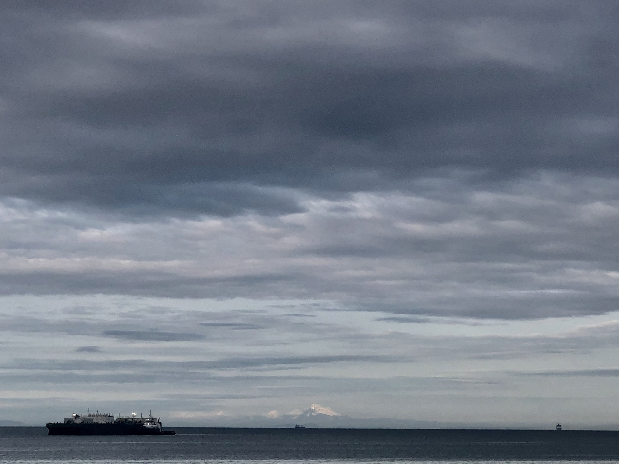 Climbing Mt. Baker by bike - view of Mt. Baker across the Salish Sea 