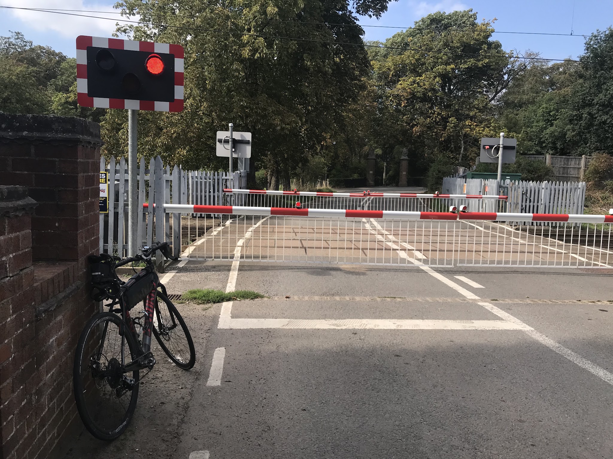 Bicycle climb Mow Crop - #36 Simon Warren 100 Greatest Cycling Climbs, Britain - bike leaning against fence at railway crossing