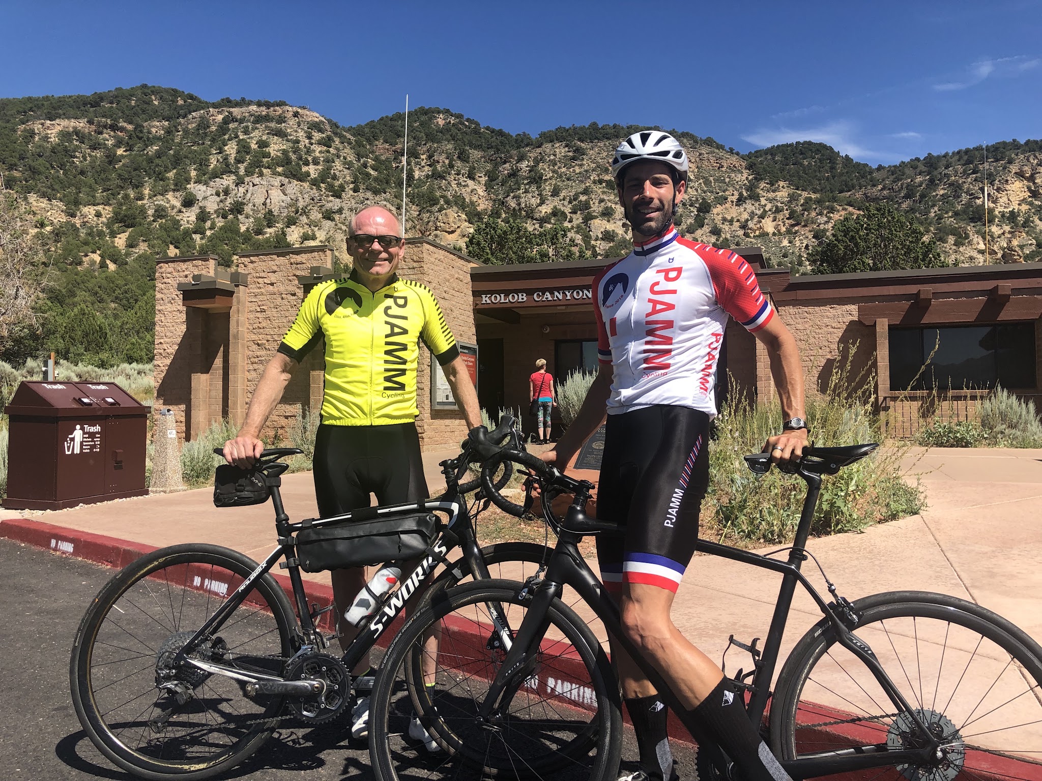 Bike climb Kolob Canyon Road - PJAMM's John Johnson and Tayler Hocket with bikes at Visitor Center