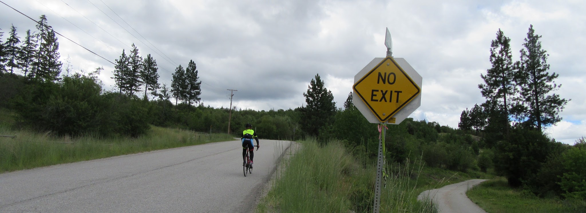 Cycling Carmi Avenue - cyclist passing no outlet sign