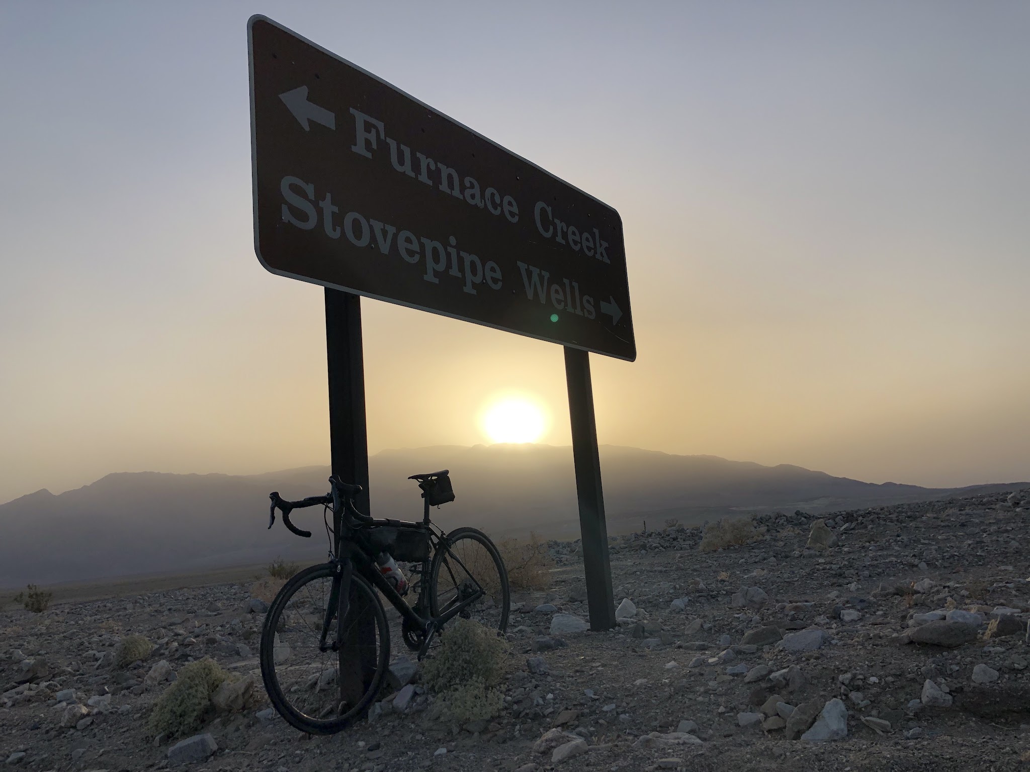 Bike climb Daylight Pass Death Valley - road and mountains