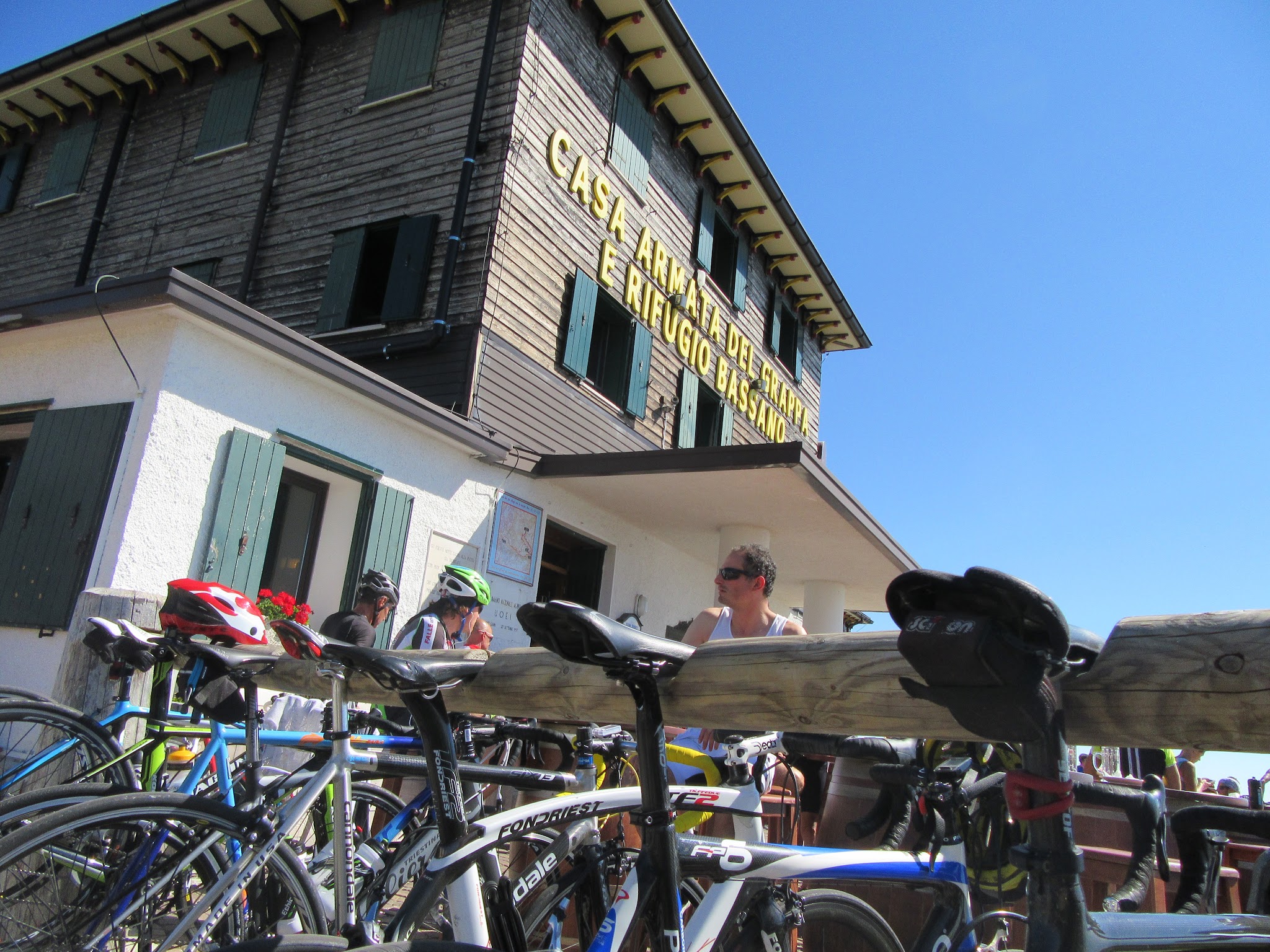 cycling  Monte Grappa from Semonzo - refugio, bikes, tables and sign