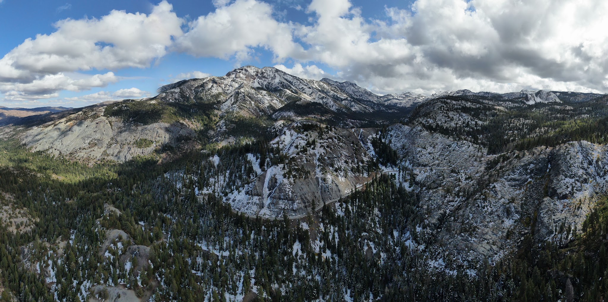 Cycling Ebbetts Pass - aerial drone video of the mountain and snow