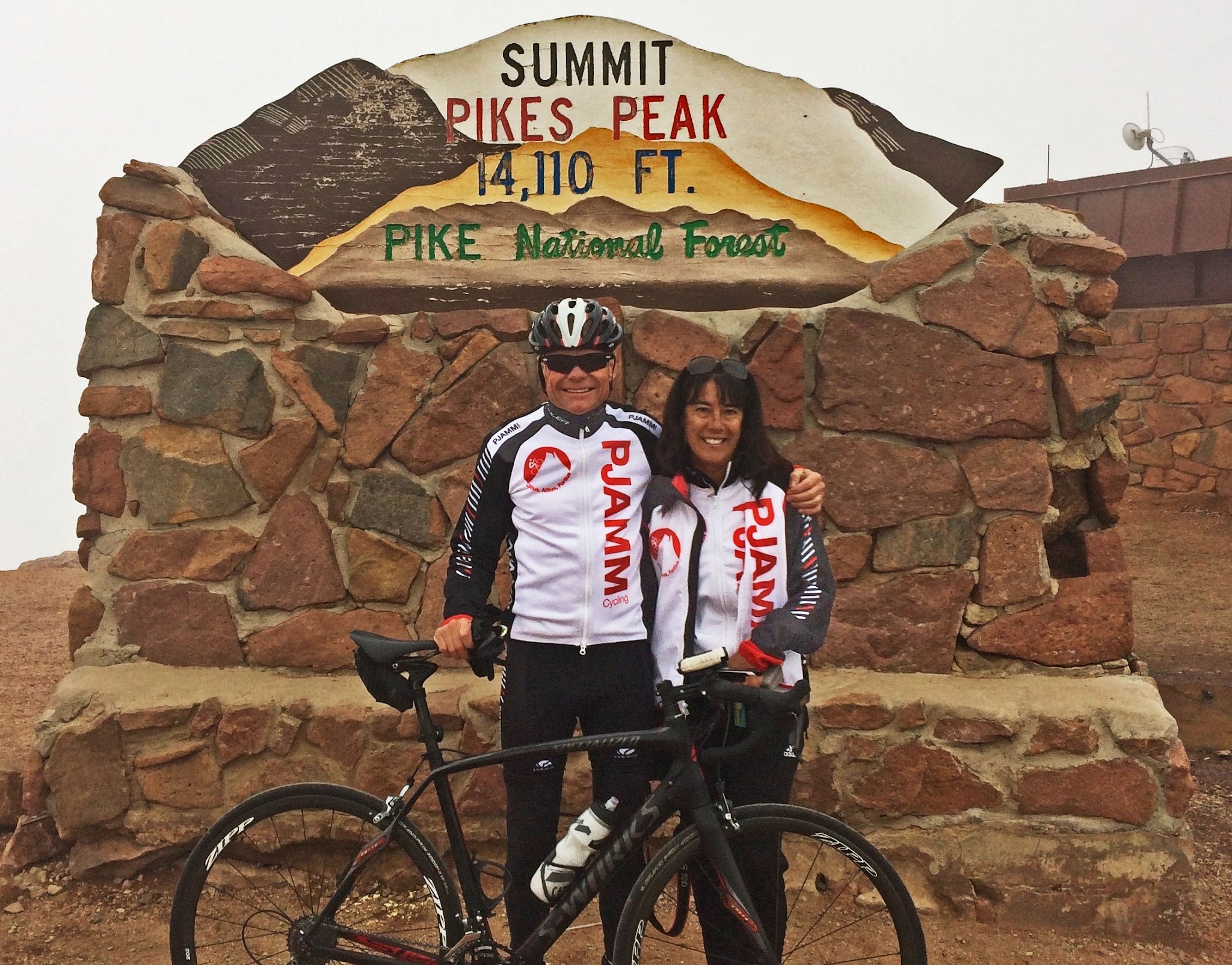 John and Rochelle Johnson at Pikes Peak sign 2015
