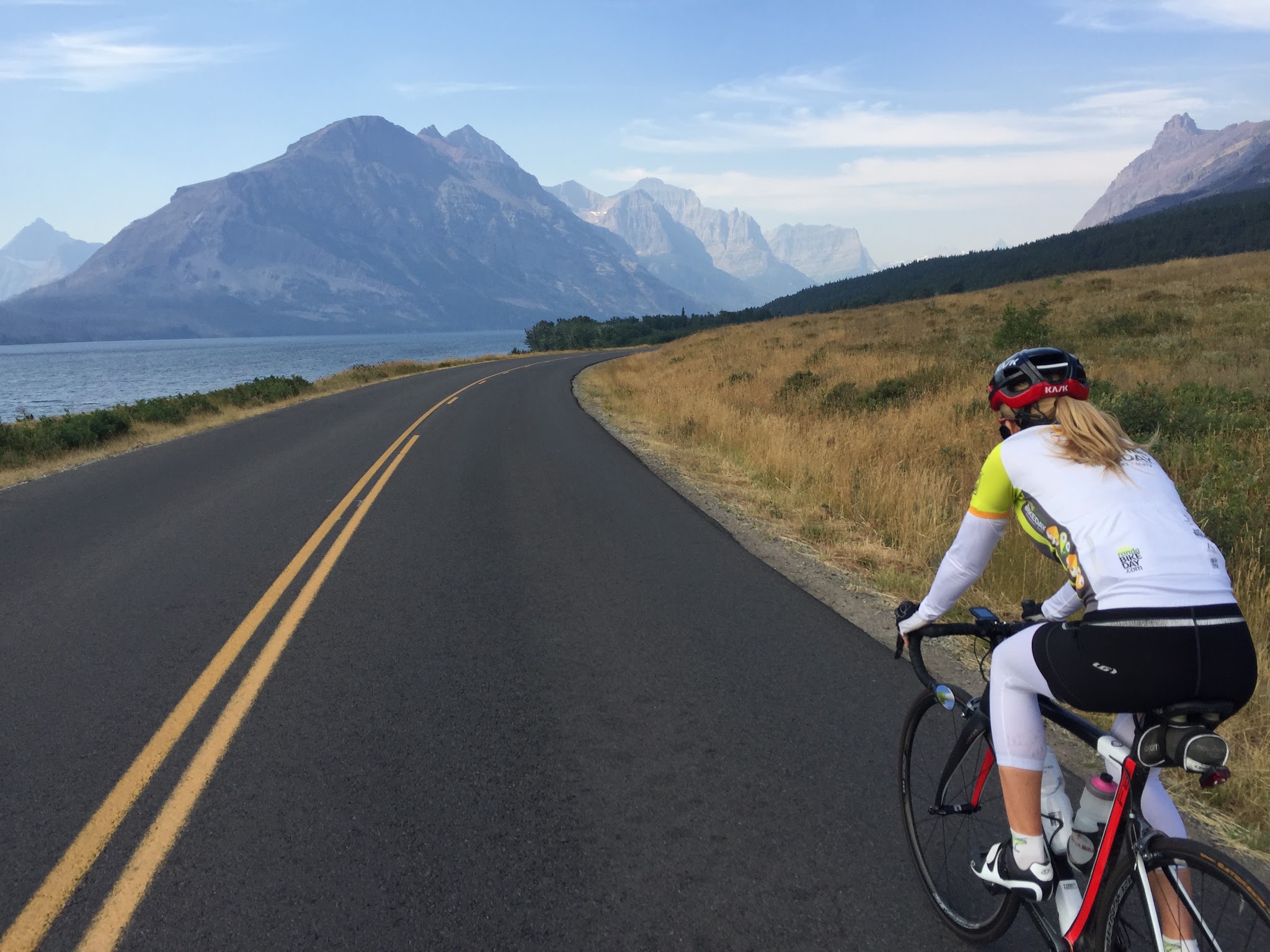 Bicycle ride Going to the Sun Road - Logan Pass - cyclist on road near Saint Mary Lake
