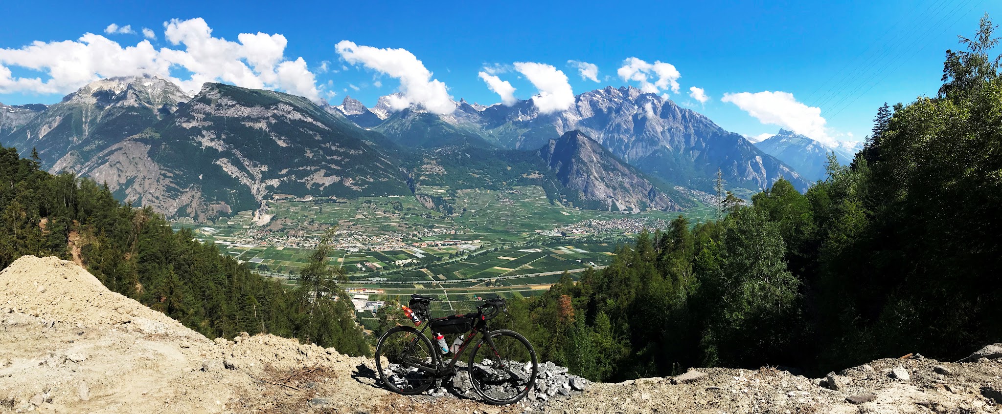 Cycling Top Swiss bike climbs near Sion - Croix de Coeur-Riddes - bike with valley and mountains in background