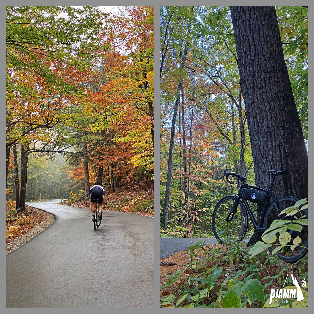 Cycling Hurricane Mountain Road West, New Hampshire - cyclist climbing on wet, one-lane roadway covered in bright yellow and red fall foliage, bike parked against large tree on roadside