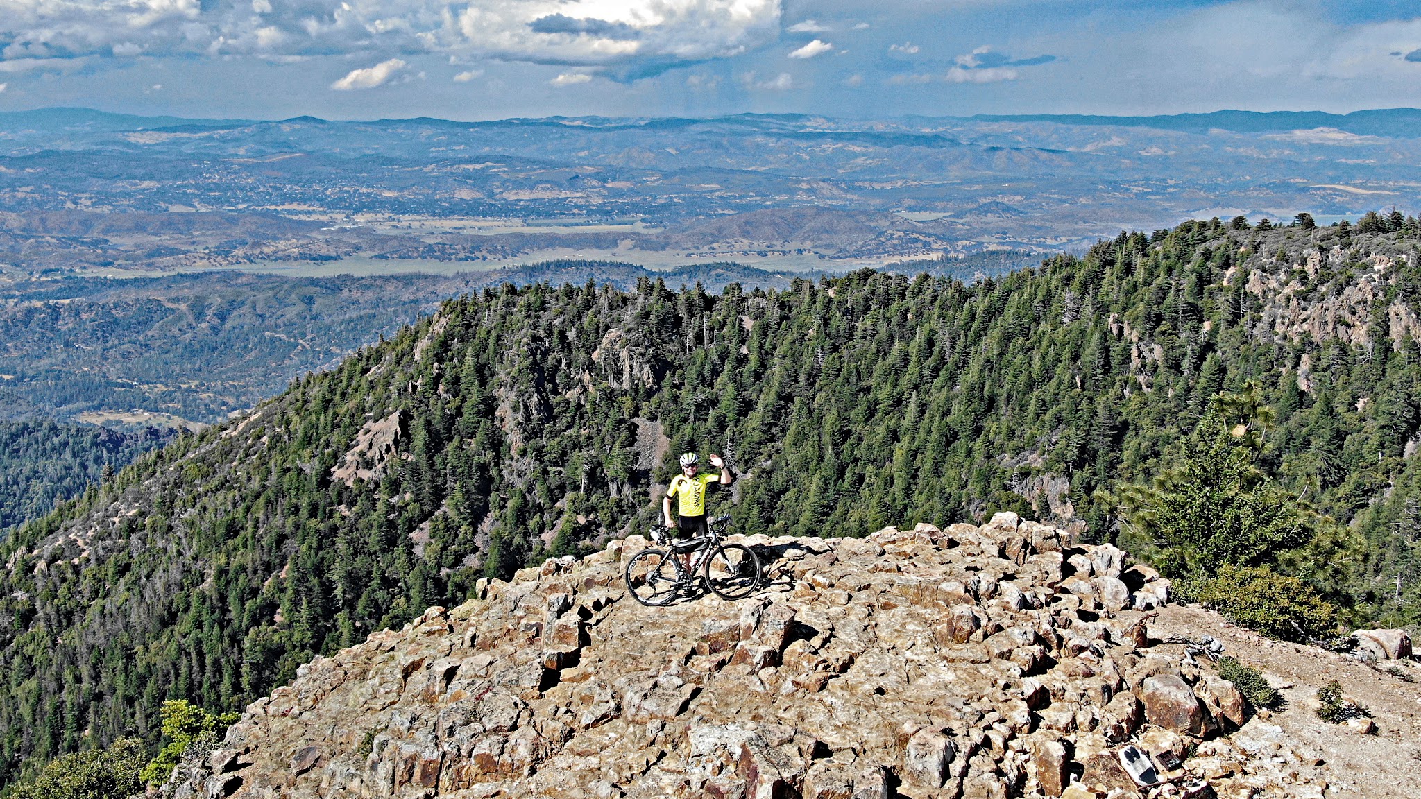 Cycling Mt. St. Helena - cyclist on the summit waiving with bike - DJI Mavic 2 Zoom aerial drone photo