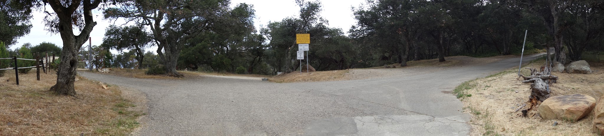Riding bike up Refugio Road - pano of Refugio Pass and road sign