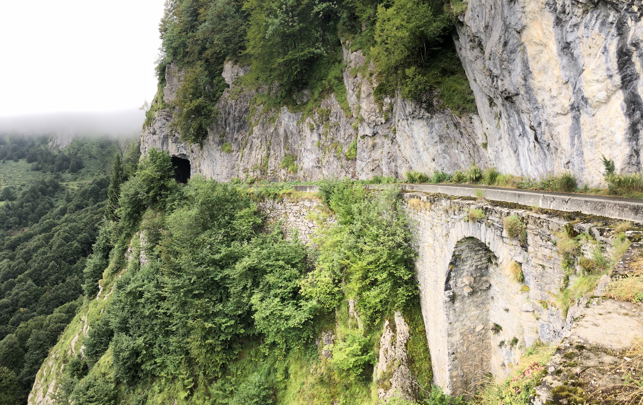 Cycling Col d'Aubisque from Ferrières - roadway, tunnel and cliff between Col du Soulor and Col d' Aubisque