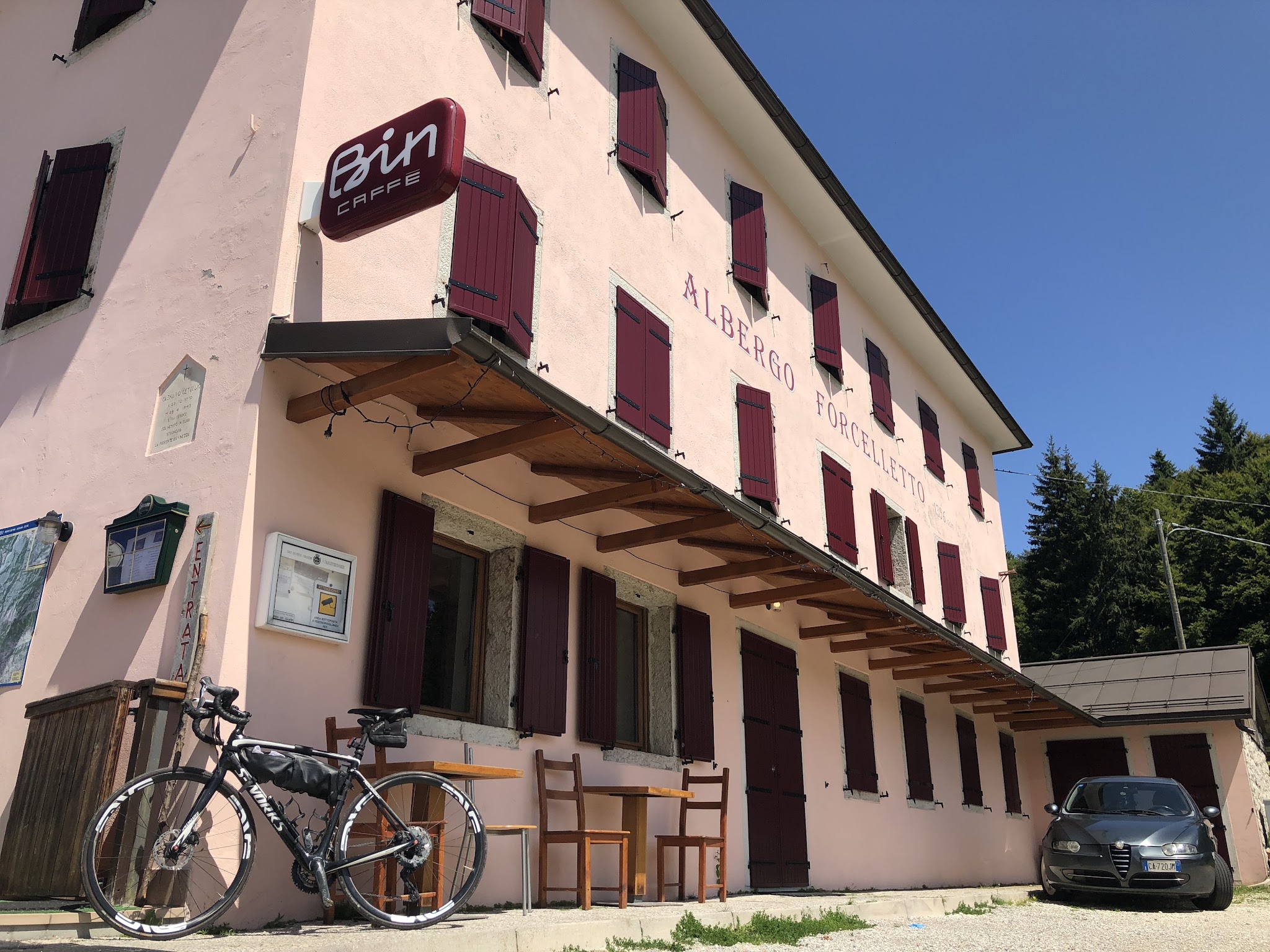 Cycling Monte Grappa from Seren - bike leaning against Albergo Forcelletto