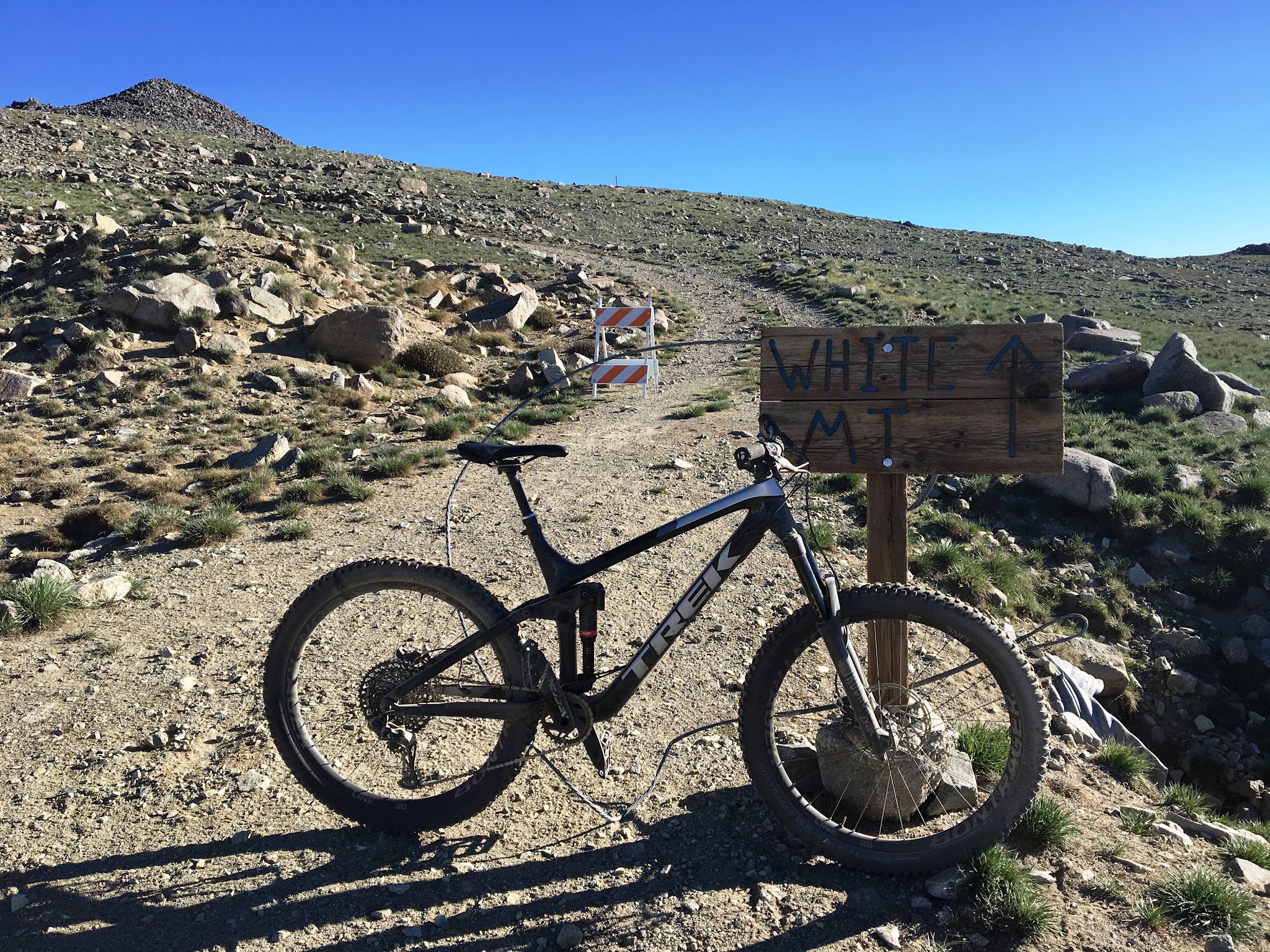White Mountain Peak from Big Pine, California - mountain bike parked in front of sign reading White Mountain, gravel roadway