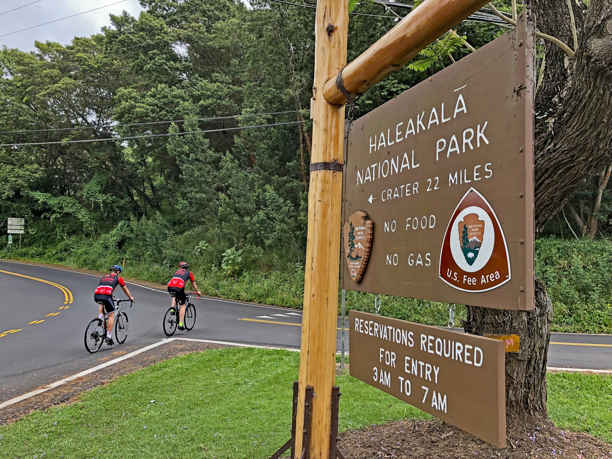 Riding by bike past the Haleakala park sign