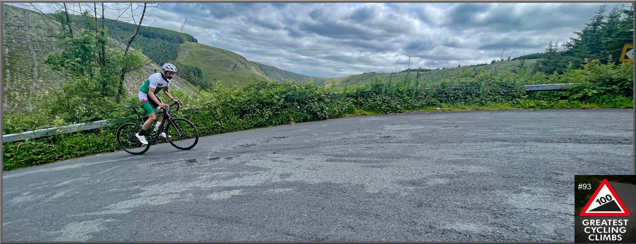 PJAMM Cyclist rides up steep, curved portion of roadway