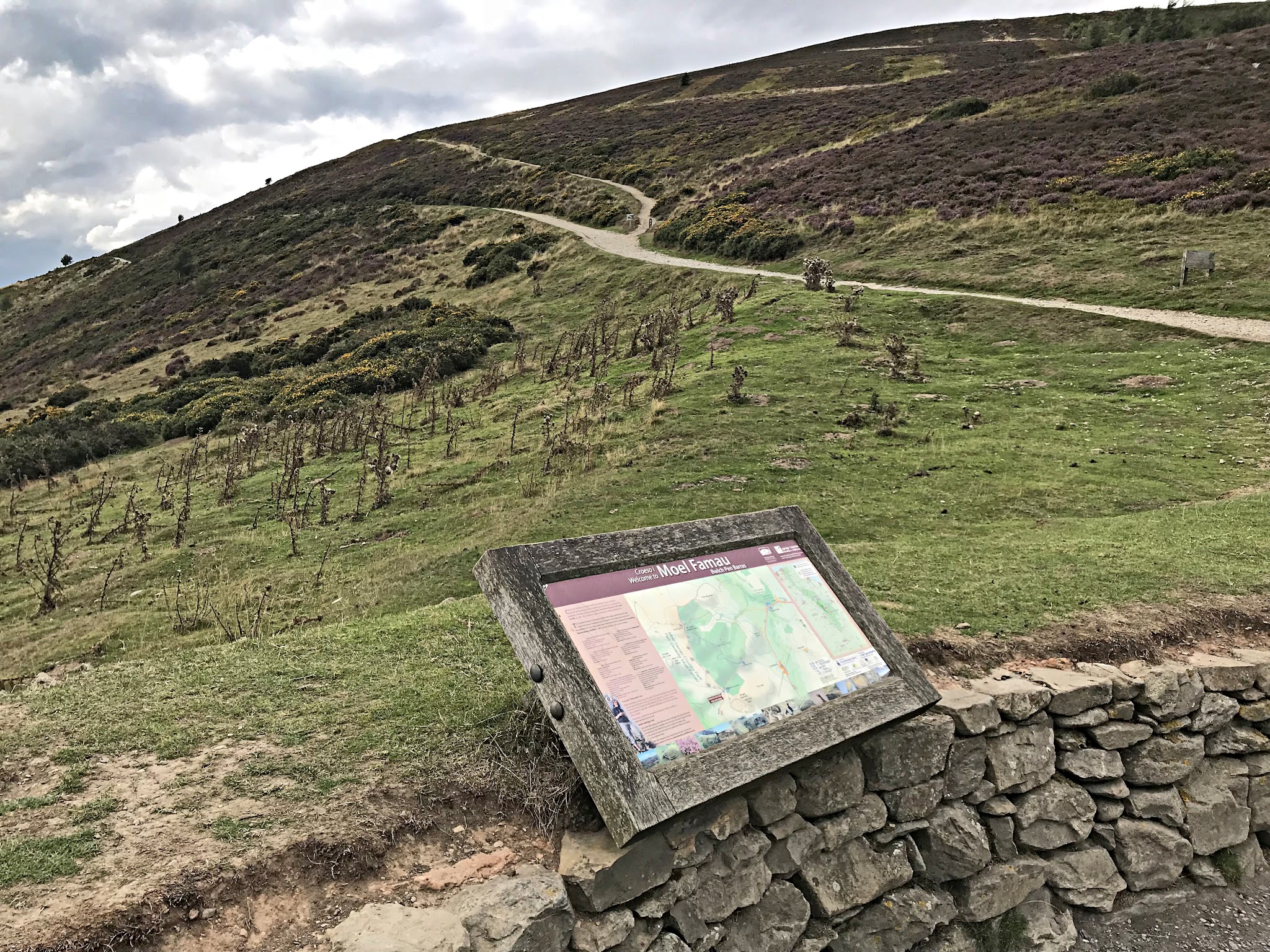 Offa's Dyke Path hiking trail and informational sign at climb's summit
