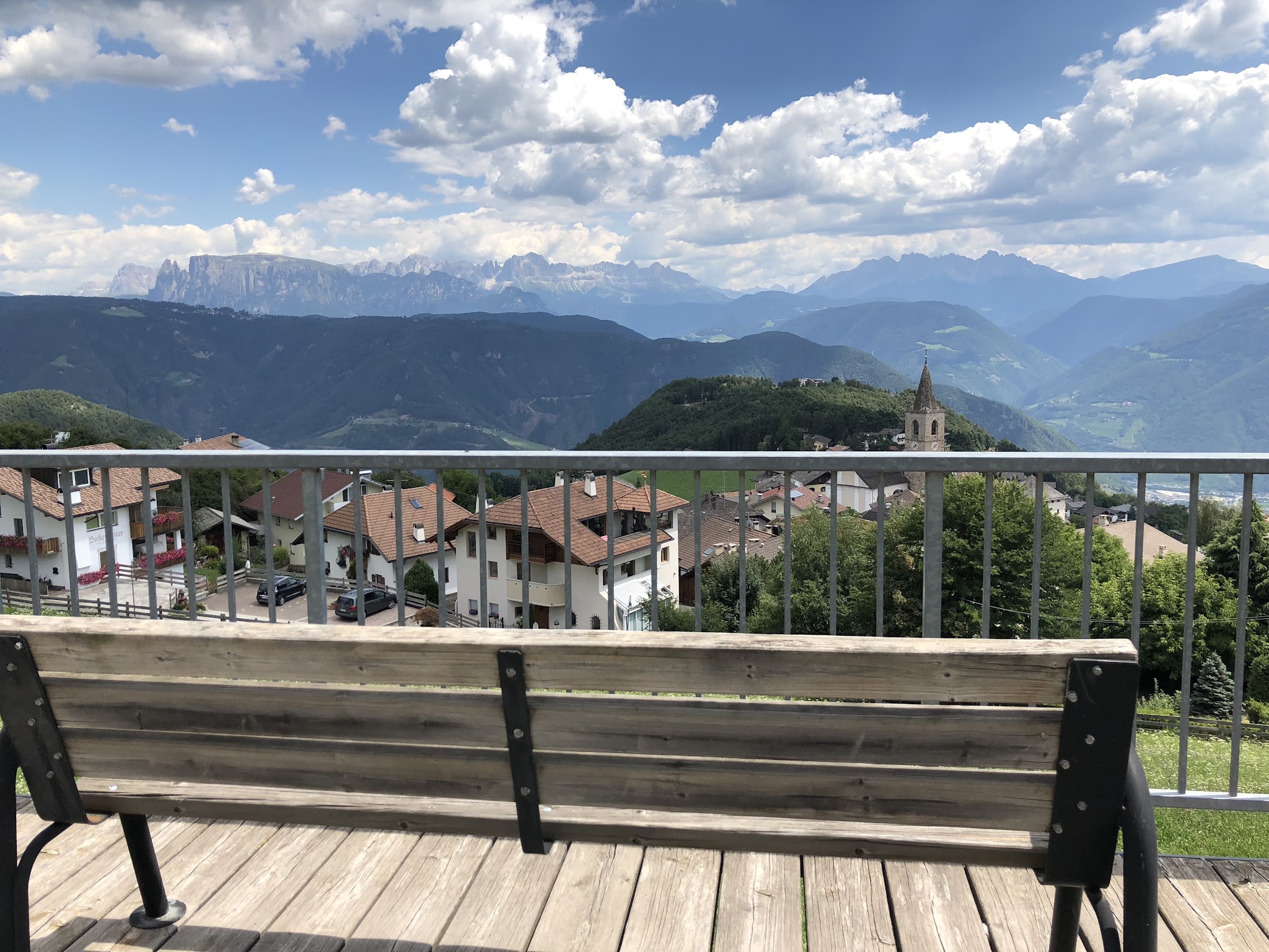 bench on patio overlooking town