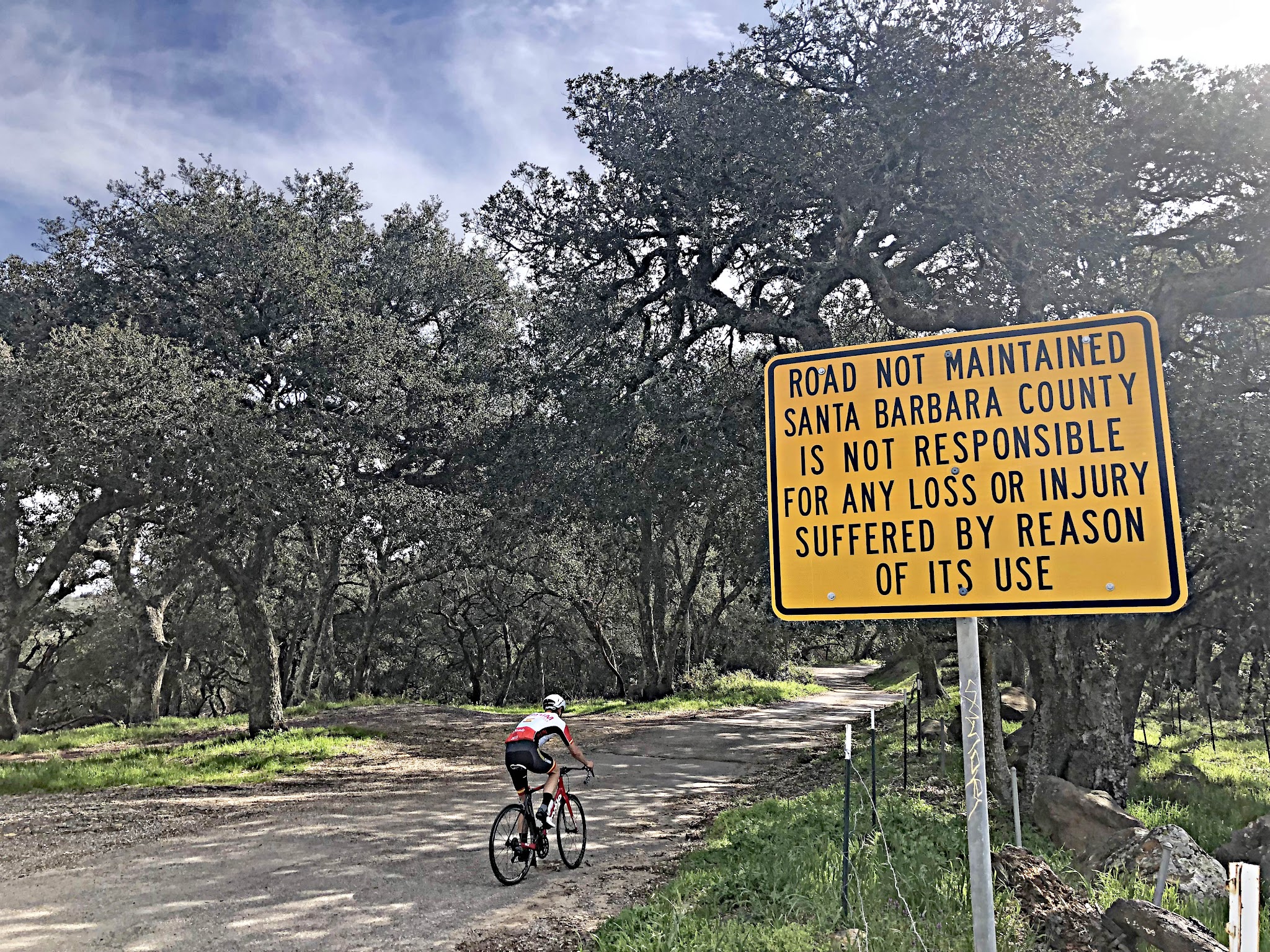 Bicycle ride Refugio Road - pjamm cyclist riding past road sign