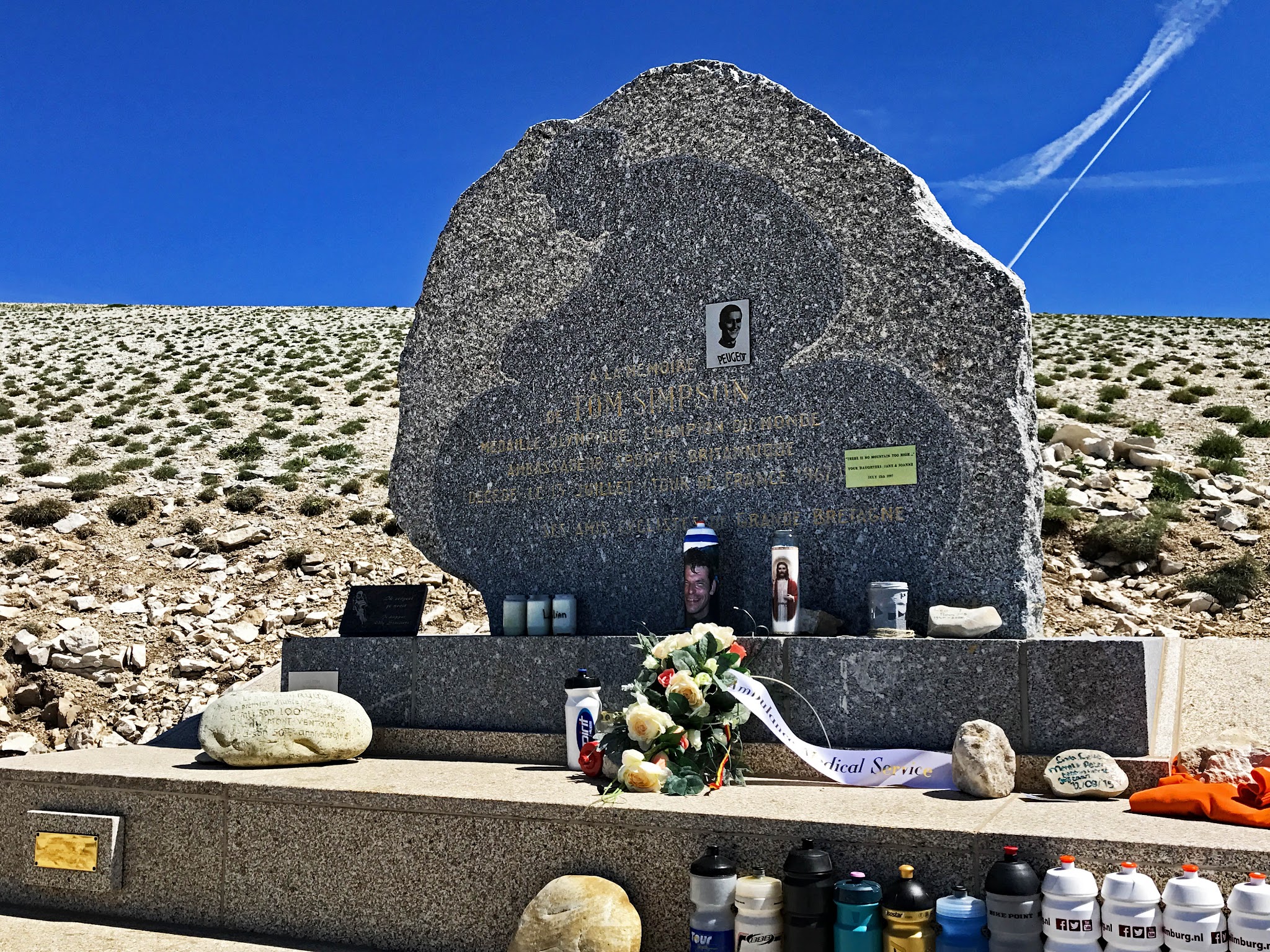 Climb Mont Ventoux by bicycle - Tom Simpson Memorial - water bottles and flowers