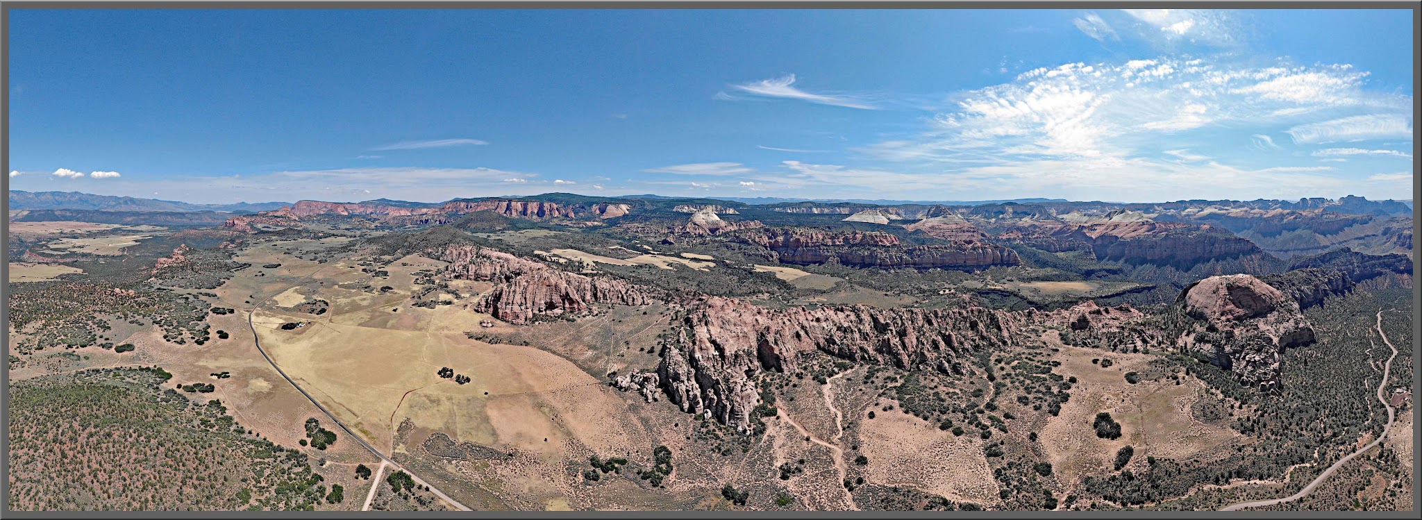 Cycling Kolob Terrace Road - aerial drone photo of road and mountains