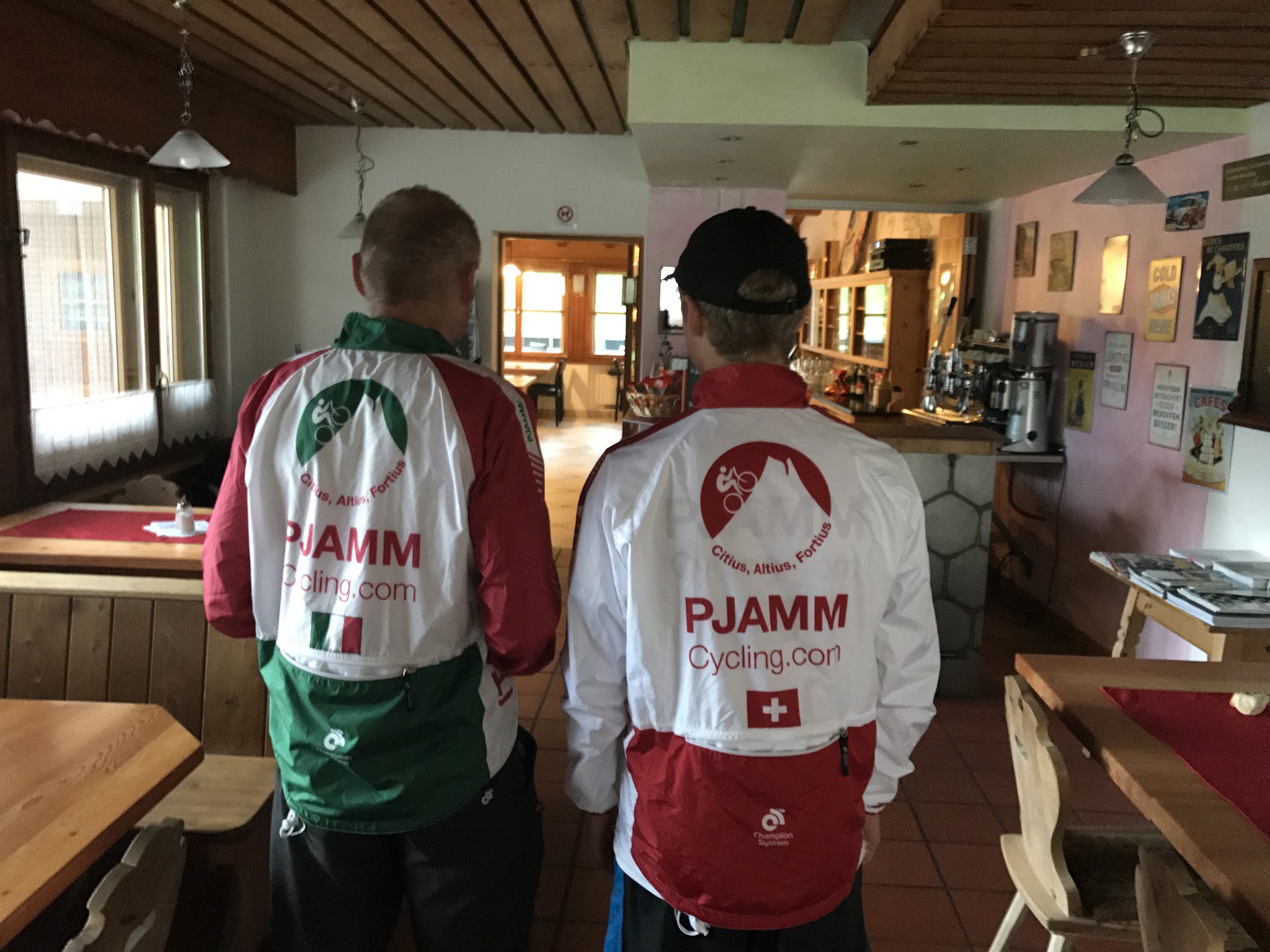 Cycling Umbrail Pass - cyclists in Swiss and Italian gear