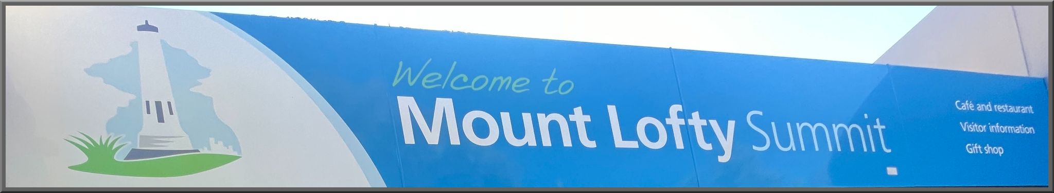 sign reads "Welcome to Mount Lofty Summit"
