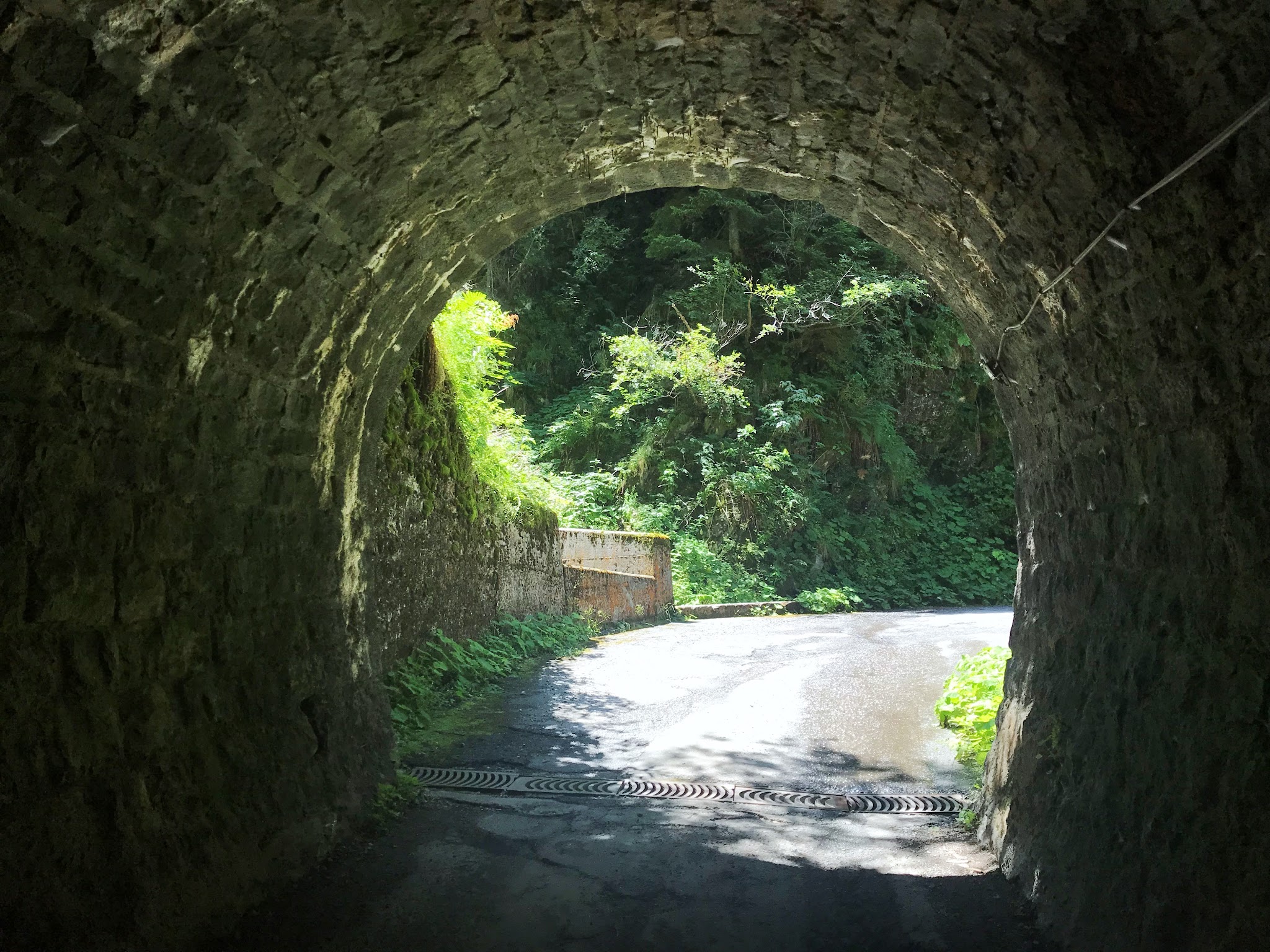 Cycling Alpe di Cadinello  - looking out end of tunnel