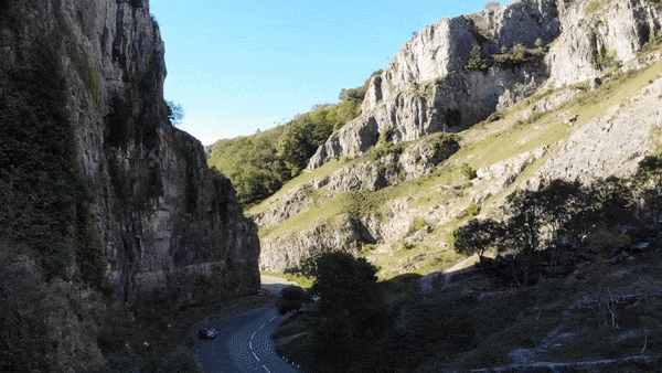 Cycling Cheddar Gorge - arial drone view of winding roads and limestone rock walls of Cheddar Gorge