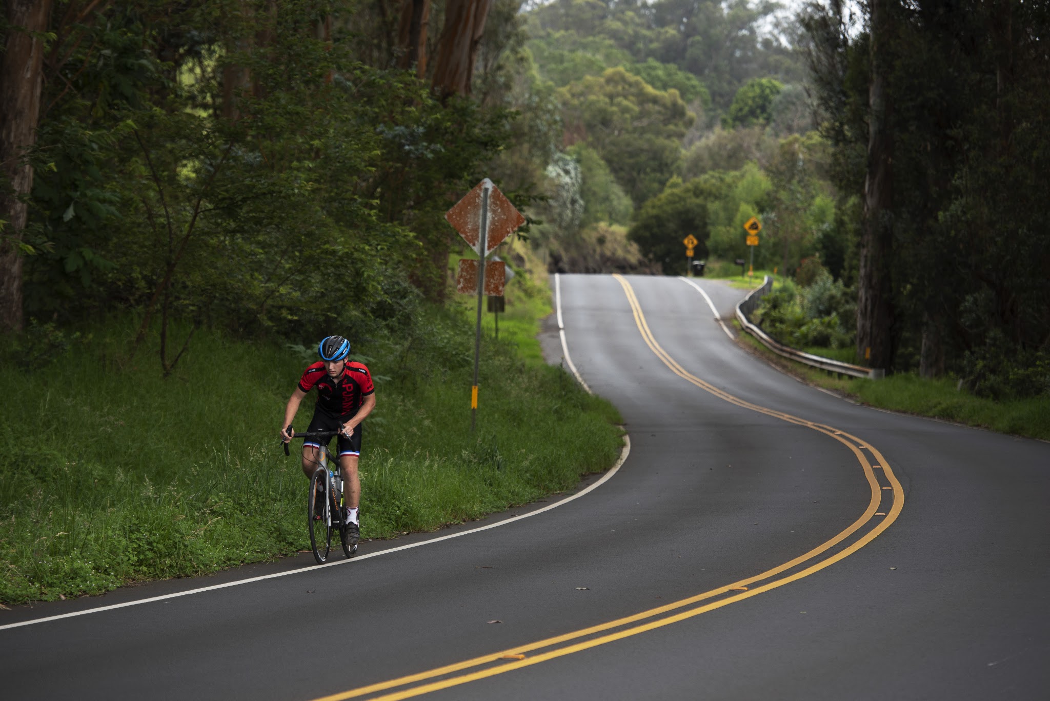 Riding by bike past the Haleakala park sign