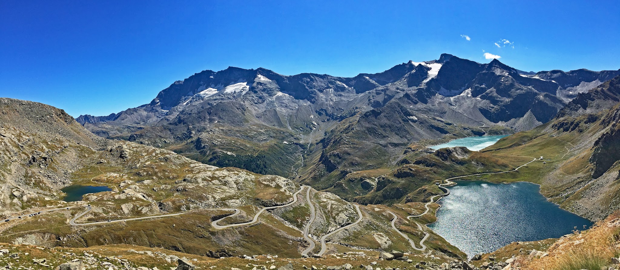 Cycling The most beautiful and scenic bicycle climb in the world - Col de Nivolet - hairpins, lake, snow capped mountain