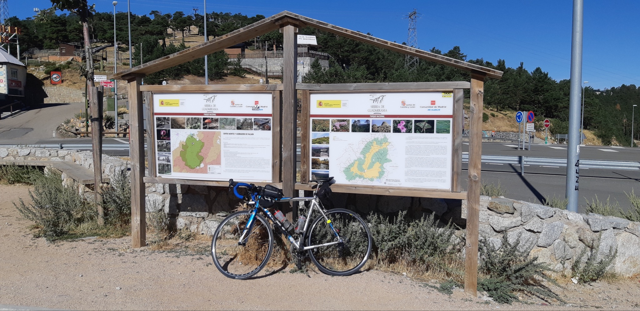 Cycling Bola del Mundo vía Puerto Navacerrada, Spain - bike parked next to informational signs