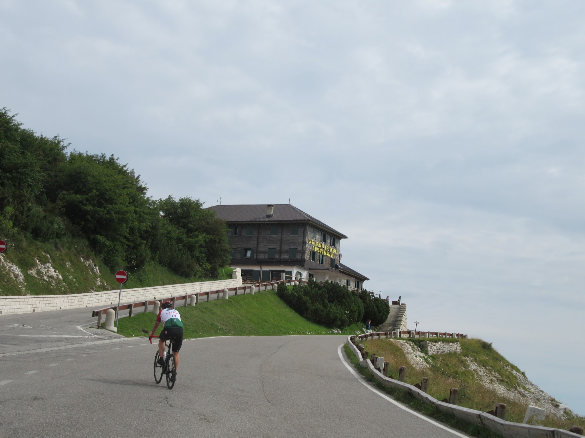 Cycling Monte Grappa from Fietta - cyclist riding on road to Rifugio Bassano a cima Grappa